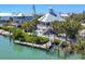 Amazing home with a dock and a pool overlooking the canal, surrounded by lush greenery at 310 Kettle Harbor Dr, Placida, FL 33946