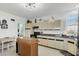 A kitchen offers an island with granite counter top and modern appliances at 310 Kettle Harbor Dr, Placida, FL 33946