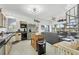 Bright, open kitchen with an island, stainless steel appliances, and easy access to the screened patio at 310 Kettle Harbor Dr, Placida, FL 33946
