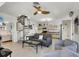 Cozy living room with spiral staircase, comfortable seating, and an open layout connecting to the kitchen and bedroom at 310 Kettle Harbor Dr, Placida, FL 33946