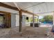 Sheltered outdoor space with living area, TV, and access to a sparkling pool at 310 Kettle Harbor Dr, Placida, FL 33946