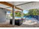 Inviting outdoor area with a pool, TV, lounge seating and waterfront views at 310 Kettle Harbor Dr, Placida, FL 33946