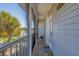 Relaxing screened-in porch offering a peek of waterfront views, complete with a welcome mat and seating at 310 Kettle Harbor Dr, Placida, FL 33946