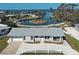 Aerial view of home with waterfront access and picturesque landscaping at 408 S Mccall Rd, Englewood, FL 34223