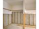 Basement featuring block walls with wooden beams and concrete flooring at 408 S Mccall Rd, Englewood, FL 34223
