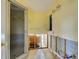 Bathroom with shower, yellow walls, tile floors and no drywall at 408 S Mccall Rd, Englewood, FL 34223