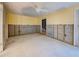 Bedroom with ceiling fan, damaged walls, and windows allowing ample natural light at 408 S Mccall Rd, Englewood, FL 34223