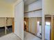 Unfinished closet with visible studs and a sliding door provides ample storage space at 408 S Mccall Rd, Englewood, FL 34223