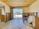 A view from the dining area to the backyard that offers abundant natural light, creating a cozy atmosphere at 408 S Mccall Rd, Englewood, FL 34223