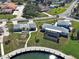 A bright home near the water with an adjacent property featuring a screened-in pool for outdoor enjoyment at 408 S Mccall Rd, Englewood, FL 34223