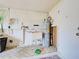 Functional laundry room with utility sink, pegboard, and water heater at 408 S Mccall Rd, Englewood, FL 34223