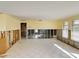 A bright living room space with tile flooring and well-lit with large windows at 408 S Mccall Rd, Englewood, FL 34223