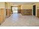 Spacious living room with a large window offering abundant natural light and tile flooring throughout at 408 S Mccall Rd, Englewood, FL 34223