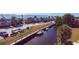 Townhomes with canal access, boat docks, and lush tropical landscaping create a waterfront community at 4410 Warren Ave # 217, Port Charlotte, FL 33953