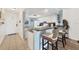 Modern kitchen featuring granite countertops, stainless steel appliances, and bar seating at 4410 Warren Ave # 217, Port Charlotte, FL 33953