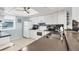 Bright kitchen features white cabinetry, modern appliances, and stylish tiled backsplash for a contemporary look at 4410 Warren Ave # 217, Port Charlotte, FL 33953