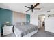 Inviting main bedroom showcases stylish accent wall, soft carpeting, and bright natural light, creating a serene space at 4410 Warren Ave # 217, Port Charlotte, FL 33953