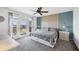 Serene main bedroom features balcony access with water views and a decorative accent wall at 4410 Warren Ave # 217, Port Charlotte, FL 33953