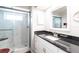 Elegant bathroom featuring a glass enclosed shower, modern fixtures, and granite countertop at 52 Mariner Ln, Rotonda West, FL 33947