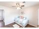 Bright bedroom featuring a daybed, ceiling fan, and closet providing a comfortable retreat at 52 Mariner Ln, Rotonda West, FL 33947
