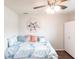 Relaxing bedroom features a bed with lots of pillows, a ceiling fan, and closet perfect for guests at 52 Mariner Ln, Rotonda West, FL 33947