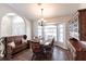 Charming dining area with a window bench, classic dining set, and a decorative hutch at 52 Mariner Ln, Rotonda West, FL 33947