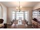 Spacious dining room featuring a large dining table, ample natural light, and traditional wooden furniture at 52 Mariner Ln, Rotonda West, FL 33947