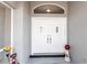 Elegant double front doors with decorative details and a welcoming entrance space at 52 Mariner Ln, Rotonda West, FL 33947