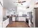 Modern kitchen with white cabinets, dark countertops, and stainless steel appliances at 52 Mariner Ln, Rotonda West, FL 33947