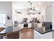 Bright kitchen with white cabinets, dark countertops, and a view of the dining area at 52 Mariner Ln, Rotonda West, FL 33947