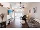 Comfortable living room with tile floors, vaulted ceilings, and sliding doors to the lanai at 52 Mariner Ln, Rotonda West, FL 33947