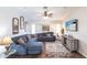 Inviting living room featuring a large sectional, stylish decor, and a modern entertainment center at 52 Mariner Ln, Rotonda West, FL 33947