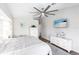 This beautifully decorated main bedroom is completed with a ceiling fan and a mounted television at 52 Mariner Ln, Rotonda West, FL 33947