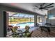 Enclosed patio with an outdoor pool overlooking the fenced-in backyard and a dining area at 52 Mariner Ln, Rotonda West, FL 33947