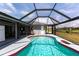 Enjoy the refreshing pool inside the screened enclosure, perfect for relaxation and entertainment at 52 Mariner Ln, Rotonda West, FL 33947