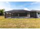 A beautiful screened in pool and lanai in a spacious backyard with room to entertain at 52 Mariner Ln, Rotonda West, FL 33947