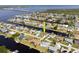 Aerial view of a waterfront neighborhood and bay featuring homes with private docks at 5266 Cooper Ter, Port Charlotte, FL 33981