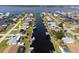 Aerial view showcasing waterfront homes and their private docks, offering scenic water access at 5266 Cooper Ter, Port Charlotte, FL 33981
