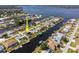 Aerial view of waterfront homes with private docks in a scenic community and easy water access at 5266 Cooper Ter, Port Charlotte, FL 33981