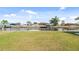 A spacious backyard with a canal view and private dock, perfect for enjoying waterfront living at 5266 Cooper Ter, Port Charlotte, FL 33981