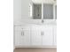 Updated bathroom with white cabinets, marble countertop, and sleek fixtures at 5266 Cooper Ter, Port Charlotte, FL 33981