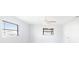 Well-lit bedroom with windows, ceiling fan, and white walls at 5266 Cooper Ter, Port Charlotte, FL 33981