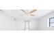 Bright bedroom with ceiling fan, neutral walls, and hallway view at 5266 Cooper Ter, Port Charlotte, FL 33981