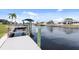 A dock with a scenic canal view showcasing waterfront living and boating opportunities at 5266 Cooper Ter, Port Charlotte, FL 33981