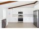 Modern kitchen with stainless steel appliances, white cabinets, and tile floors at 5266 Cooper Ter, Port Charlotte, FL 33981