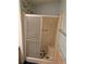Bathroom shower featuring sliding glass doors, seat, and fish-themed non-slip pads at 6162 Redwing Ave, Englewood, FL 34224