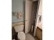 Bathroom featuring a toilet, and extra storage and shelving space for personal items at 6162 Redwing Ave, Englewood, FL 34224