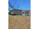 View of the back exterior with shed and air conditioning unit at 6162 Redwing Ave, Englewood, FL 34224