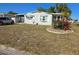Charming single-story home with well-maintained lawn and simple landscaping in a sunny setting at 6162 Redwing Ave, Englewood, FL 34224