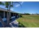 A beautiful backyard view shows well-kept landscaping and access to a golf course, adding to the property's charm at 62 Oakland Hills Pl, Rotonda West, FL 33947